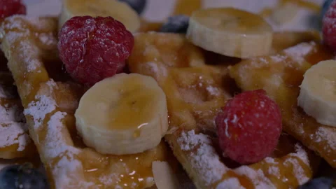 Delicious Belgian Waffles, Maple Syrup. Banana Slices and Whipped Cream Video stock 130767595