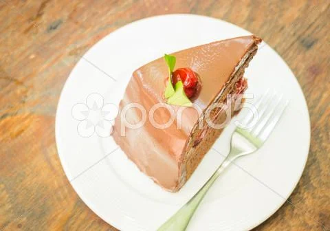 Delicious Black Forest Cake On White Plate