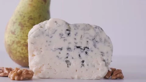Delicious blue cheese dorblu or gorgonzola with pear and walnuts Stock Footage 231235007