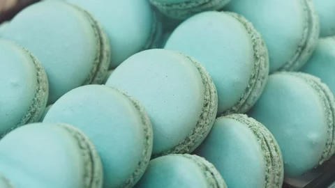 Delicious blue macarons displayed at a sweet shop Stock Footage 331492265