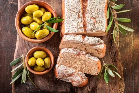 Delicious bread with extra virgin olive oil. Stock Photos
