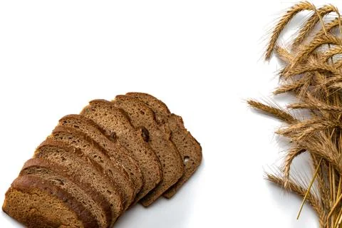 Delicious bread. Fresh loaf of rustic traditional bread with wheat grain ear  Stock Photos
