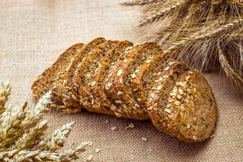 Delicious bread. Fresh loaf of rustic traditional bread with wheat grain ear  Stock Photos