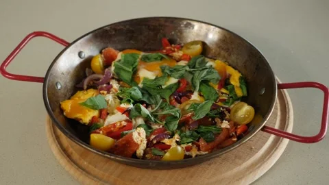 Delicious breakfast scrambled eggs with tomatoes and bell pepper Stock Footage 239924547