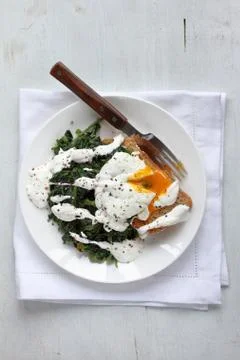 Delicious breakfast time, egg with spinach Stock Photos