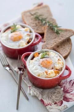 A delicious breakfast time, one serving of red pots of eggs 스톡 사진