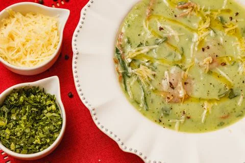 Delicious broccoli green broth, green broccoli soup, vegetarian, with grated  Stock Photos