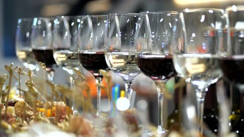 Delicious buffet table. Female hand takes a glass of white wine. 4K Slow Mo Stock-Footage 104666549