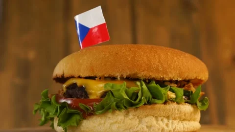 Delicious burger with small Czech flag on top of them with toothpicks. Yummy Stock Footage 145247714
