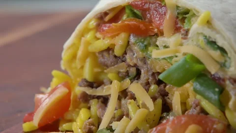 The delicious burrito is broken in half Stock Footage 315417455