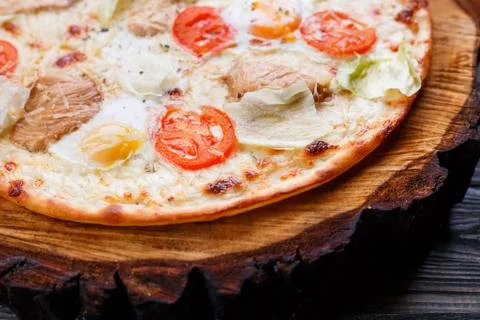 Delicious caesar pizza with cherry tomatoes, grilled chicken, le Stock Photos