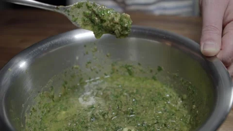 Delicious café de paris sauce is prepared by a chef. Mixing all Stock Footage 254073154