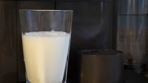 A delicious caffe latte being made by a coffee machine in slow motion Stock Footage 122249227