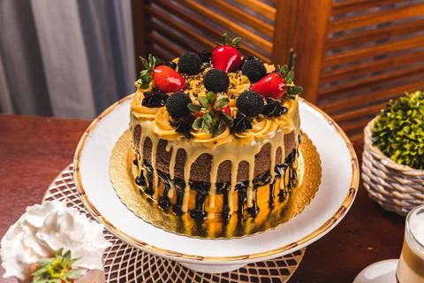 Delicious Cake On a Perfect Table With Snacks Stock Photos