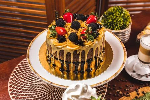 Delicious Cake On a Perfect Table With Snacks Stock Photos