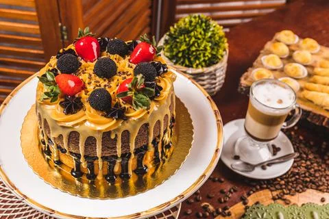 Delicious Cake On a Perfect Table With Snacks Stock Photos