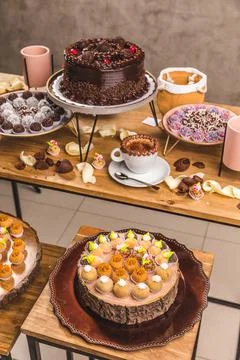 Delicious Cake On a Perfect Table With Snacks Stock Photos