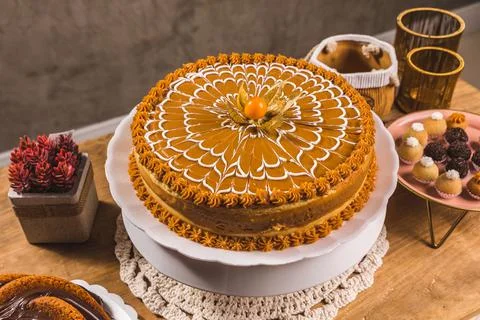 Delicious Cake On a Perfect Table With Snacks Stock Photos