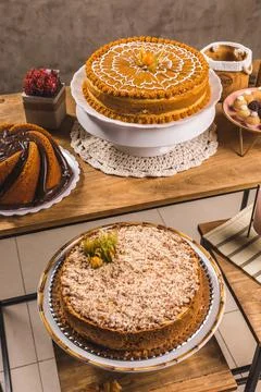 Delicious Cake On a Perfect Table With Snacks Stock Photos