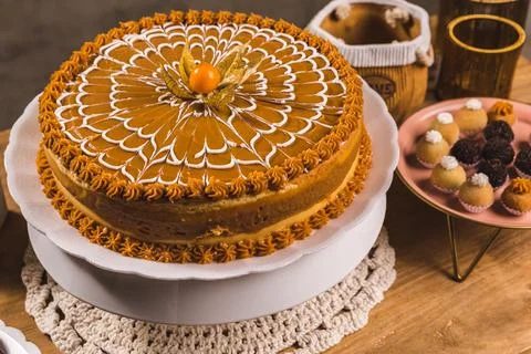 Delicious Cake On a Perfect Table With Snacks Stock Photos