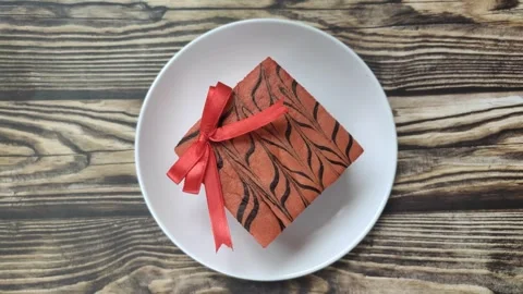 A Delicious Cake with A Red Ribbon Stock Footage 300408692