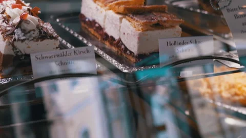 Delicious cakes in a display case Stock Footage 312008187