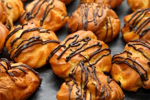 Delicious cakes eclairs on the table Stock Photos