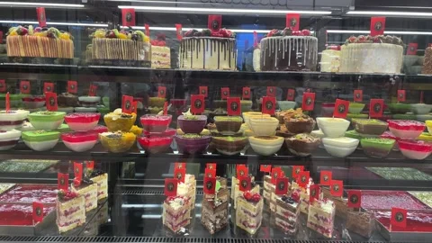 Delicious cakes in store Stock Footage 241141477