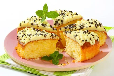 Delicious cheese and herb mini cakes on plate Stock Photos