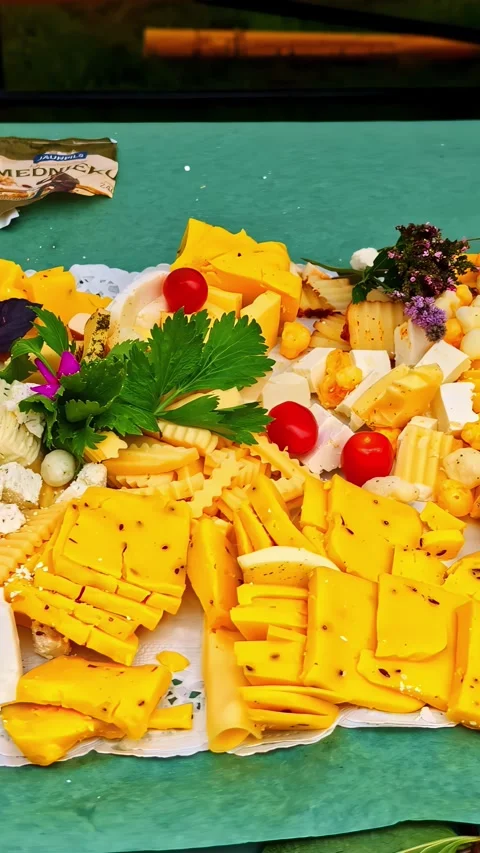 Delicious cheese plate with assorted dairy products Video stock 336297533