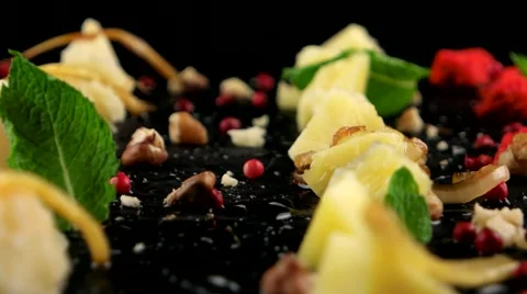 Delicious cheese platter on the black stone tray, closeup, loop Stock Footage 66482687