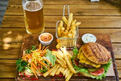 A delicious cheeseburger on the table Stock Photos