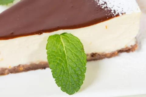 Delicious cheesecake with mint. Stock Photos
