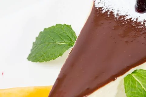 Delicious cheesecake with mint. Stock Photos