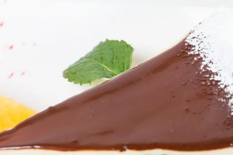 Delicious cheesecake with mint. Stock Photos