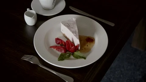 Delicious cheesecake with stowberry on table close up. Stock Footage 166706371