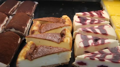 Delicious Cheesecakes and Assorted Sweets on Cafe Dessert Stand Stock Footage 314195052