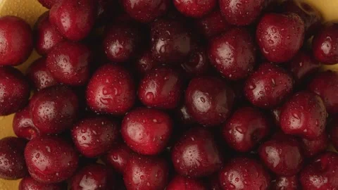 Delicious cherries on a rotating plate Stock Footage 135577587