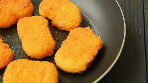 Delicious chicken nuggets cooked on vegetable oil Stock Footage 70089626