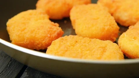 Delicious chicken nuggets cooked on vegetable oil Stock Footage 70089712