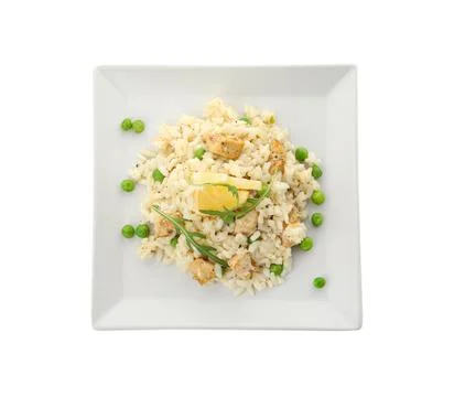 Delicious chicken risotto and lemon slices isolated on white, top view 写真素材