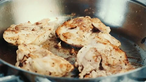 Delicious chicken steaks fried in a pan. Video stock 132654302