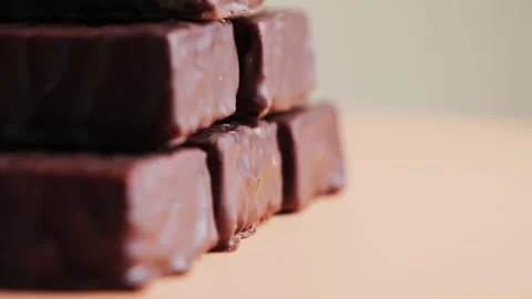Delicious chocolate bars on a rotating surface. Protein bars close up. Snack Stock Footage 335690527