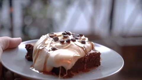Delicious chocolate brownie serving Stock Footage 98239956