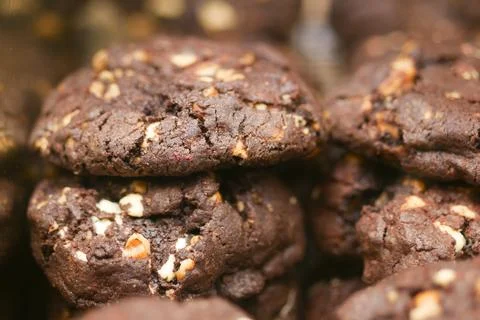 Delicious Chocolate Cookies Stack with Nuts and Chocolate Chunks 스톡 사진