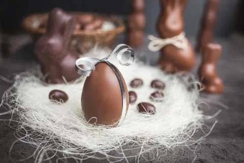 Delicious chocolate Easter egg with a ribbon Stock Photos