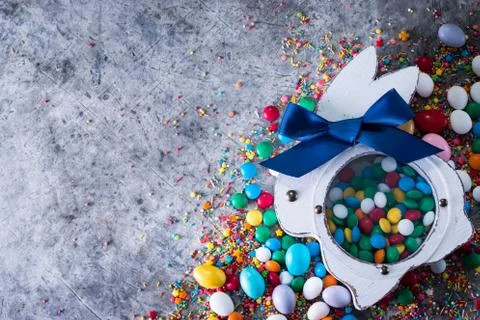 Delicious chocolate easter eggs ,bunny and sweets on dark gray background Stock Photos
