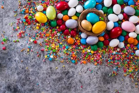 Delicious chocolate easter eggs ,bunny and sweets on dark background Stock Photos
