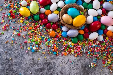 Delicious chocolate easter eggs ,bunny and sweets on dark background Stock Photos
