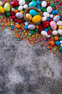 Delicious chocolate easter eggs ,bunny and sweets on dark background Stock Photos